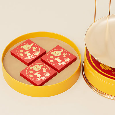 Hộp bánh Trung Thu hình lồng chim vàng - mở nắp hiển thị 3 hộp nhỏ đỏ với họa tiết thỏ và mây B2B